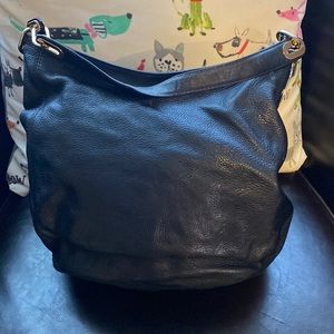 Gorgeous Michael Kors leather purse with gold hardware.